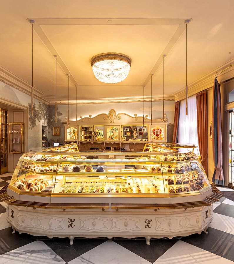 Front view of the white/gold sales counter of the Zauner confectionery.