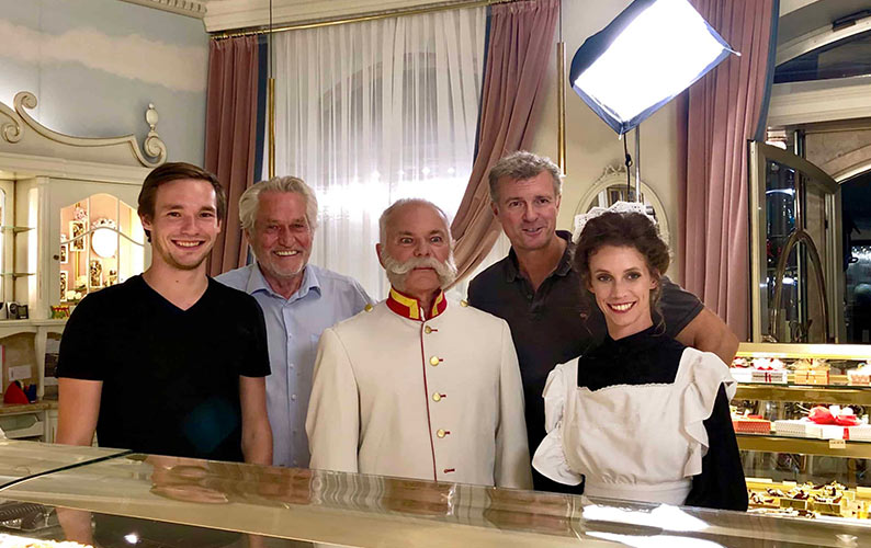 Filming the commercial for the Zauner Konditorei. Group photo with actors, as well as Josef and Philipp Zauner.