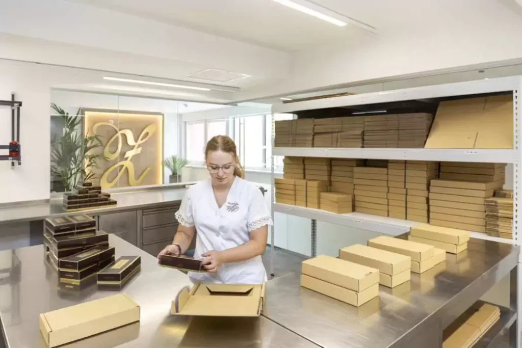 A Zauner employee packages Zaunerstollen.