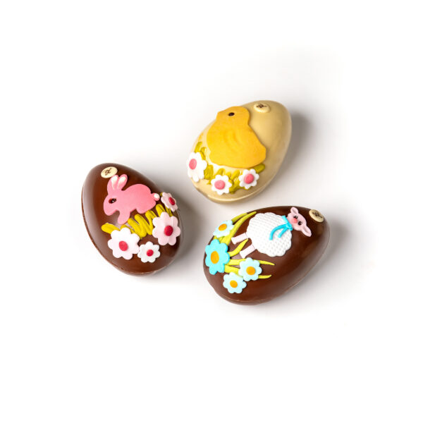 Hand-decorated chocolate eggs in white and light chocolate, each weighing 180g